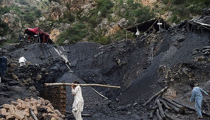 Miners fix a collapsed coal mine in Akhurwal village, in Darra Adam Khel town. — AFP/File