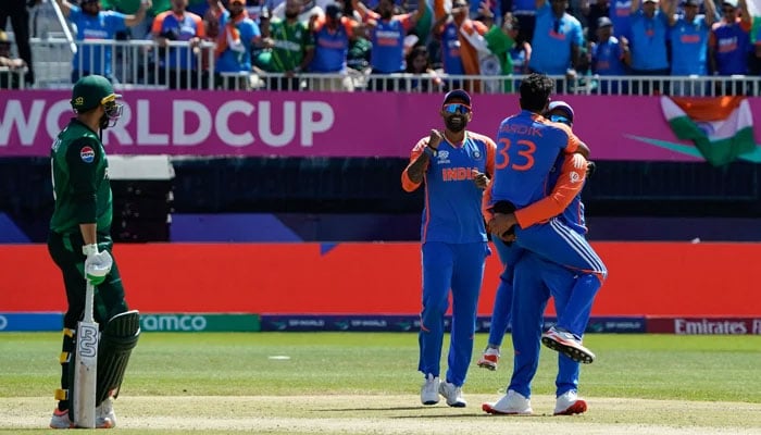 Hardik Pandya celebrates with teammates after India took a wicket during the ICC mens Twenty20 World Cup 2024 group A cricket match between India and Pakistan at Nassau County International Cricket Stadium in East Meadow, New York on June 9, 2024. — AFP