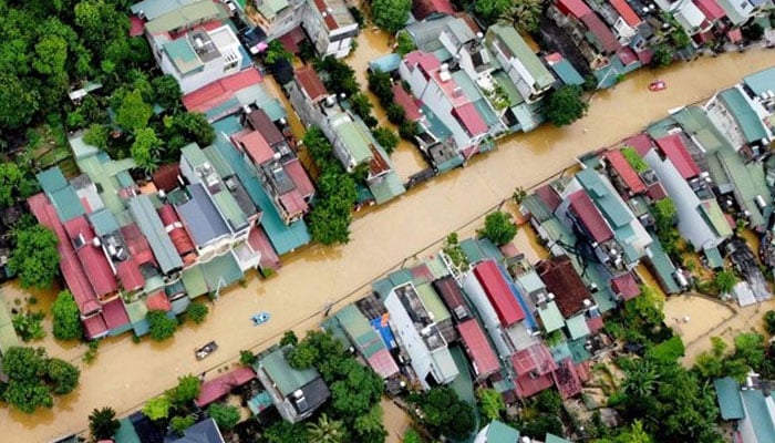 Flood waters submerged buildings after heavy rain in Ha Giang city in northern Vietnam on June 10, 2024. — AFP