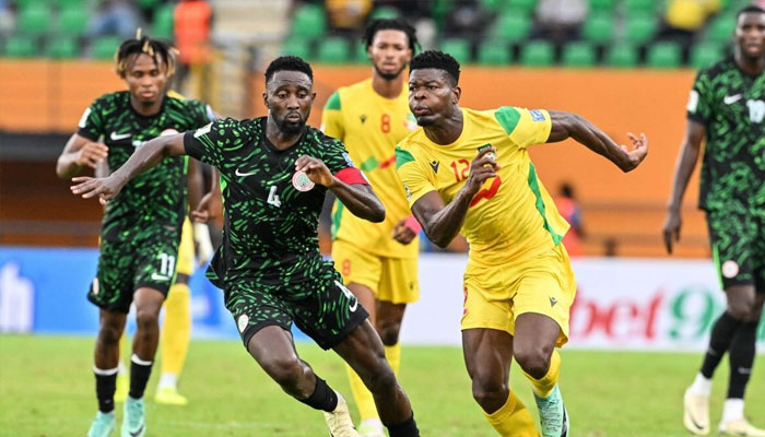 Benin’s David Kiki fights for the ball with Nigerias Wilfred Ndidi during the FIFA 2026 World Cup qualifiers group C football match between Benin and Nigeria at the Felix Houphouet-Boigny stadium in Abidjan on June 10, 2024. — AFP