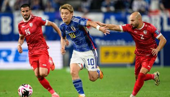 Japans Ritsu Doan (centre) pictured alongside Syrian players during the joint 2026 FIFA World Cup Asian qualification and 2027 AFC Asian Cup qualification football match. — AFP/File