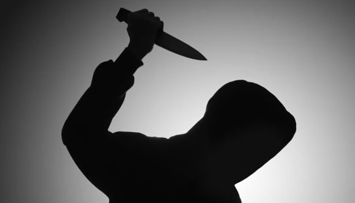 A representational image showing a silhouette of a person holding a knife. — Pexels/File