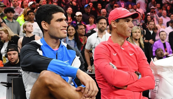 Carlos Alcaraz (L) and Rafael Nadal (R) seen sitting next to each other. — AFP/file