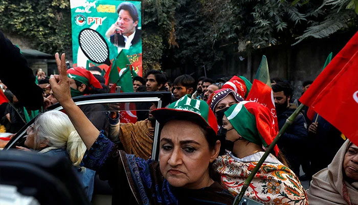 Women supporters of former premier Imran Khan hold flags during a rally ahead of the general elections in Lahore, Pakistan January 28, 2024. — Reuters