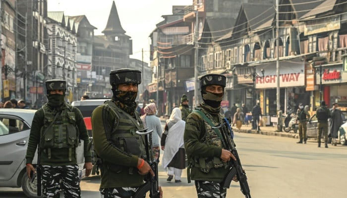 Indian paramilitary troops stand guard on a street in Srinagar. — AFP/file