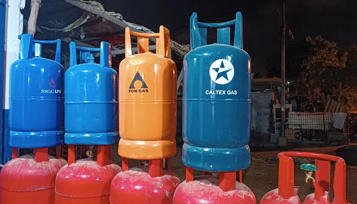 This image taken on January 31, 2024, shows gas cylinders outside a shop in Karachis Gulshan-e-Iqbal area. — reporter