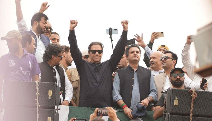 PTI Founder Imran Khan gestures at the march participants as his convoy arrives in Gujranwala on November 1, 2022. — Instagram/@ptiofficial