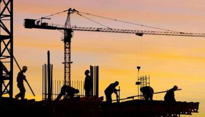 A representational image showing labourers busy in construction work at a site. — APP/File