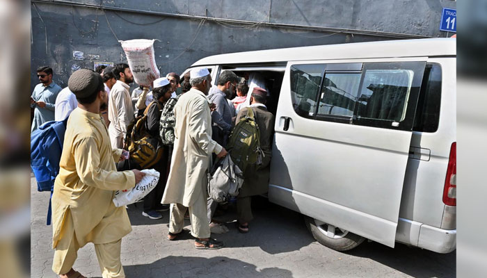 People board vehicles at the Bus Stand to travel to their hometowns to celebrate Eid ul Azha on June 13, 2024. — APP