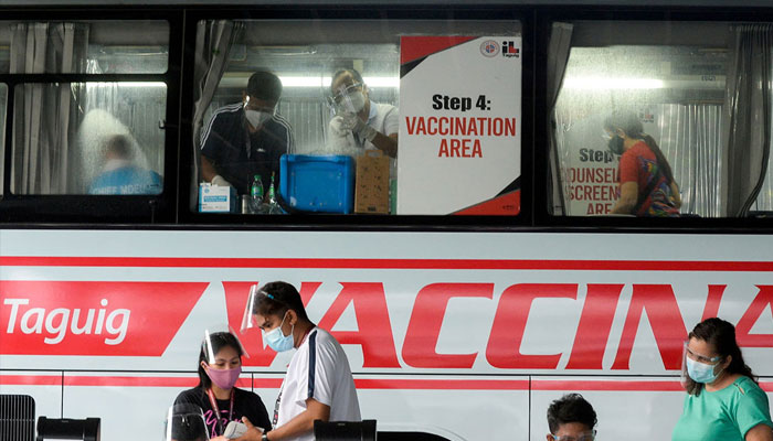 Health workers adminitering Covid-19 vaccines in this undated image. — Reuters/file