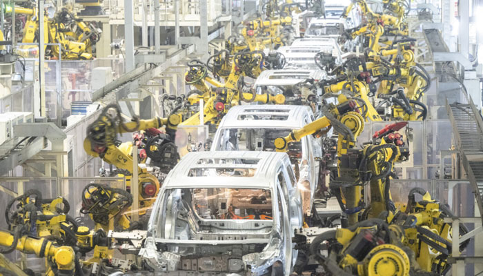 Robots work at a welding workshop of Voyah, a Chinese electric auto brand, in Wuhan, central China’s Hubei Province, April 1, 2024. —  Xinhua