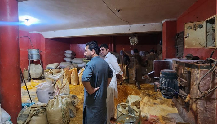 People can be seen at the premises of a spice factory on Charsadda Road in Peshawar during a raid by the Khyber Pakhtunkhwa Food Safety and Halal Food Authority inspection teams on June 15, 2024. — Facebook/Khyber Pakhtunkhwa Food Safety & Halaal Food Authority