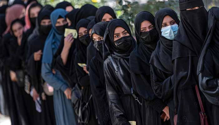 Female students queue for entrance exams at a university on 13 October 2022. — AFP/File