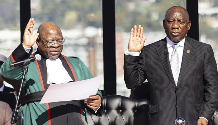 South Africa’s Cyril Ramaphosa (R) gestures takes the oath of office for his second term as South African President at the Union Buildings in Pretoria on June 19, 2024. — AFP