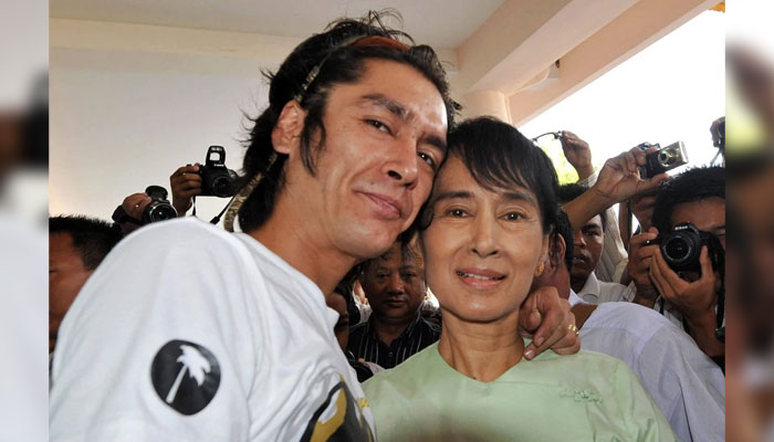 Myanmar democracy leader Aung San Suu Kyi (right) and her son Kim Aris pose for pictures in Yangon. — AFP/File