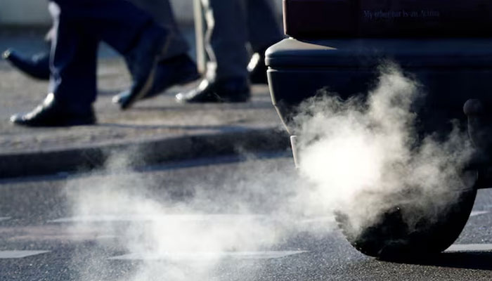 An exhaust pipe of a car is pictured on a street. — Reuters/File