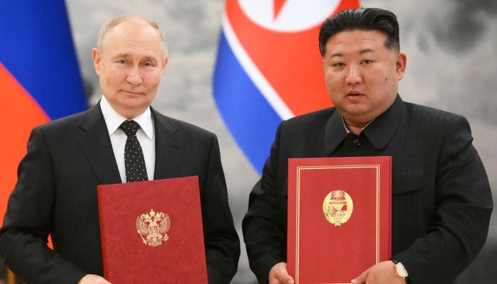 Russias President Vladimir Putin and North Koreas leader Kim Jong Un pose for a photo during a signing ceremony following bilateral talks in Pyongyang, North Korea June 19, 2024. — Reuters