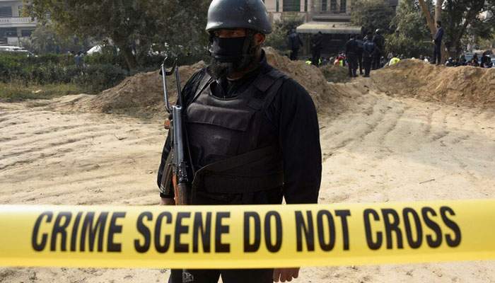 This representational image shows a police officer standing inside a cordoned-off area. — Reuters/File