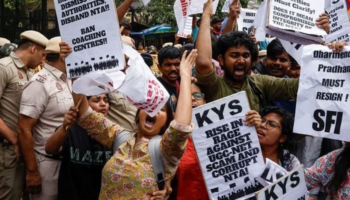 Students holding placards protest outside the Ministry of Education against the cancellation of the UGC-NET examination at New Delhi. — Reuters File