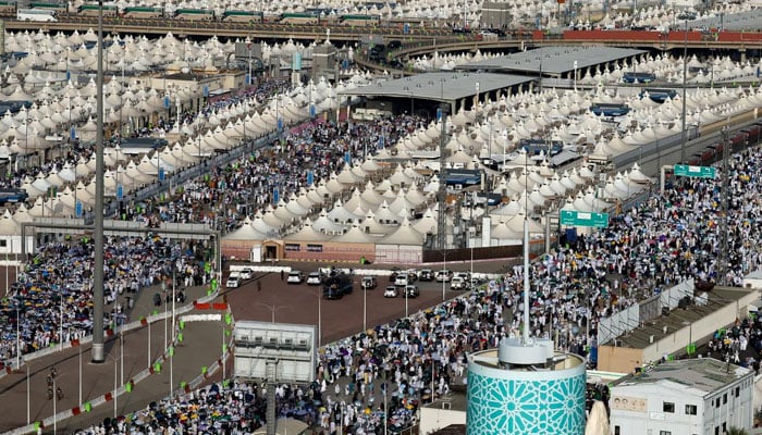 Muslim pilgrims walk on the second day of the stoning of the devil ritual, during the annual haj pilgrimage, in Mina, Saudi Arabia, June 17, 2024. — Reuters
