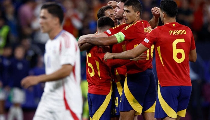 Spain players celebrate after beating Italy 1-0 in Gelsenkirchen to clinch a place in the last 16 of Euro 2024 . — AFP/file