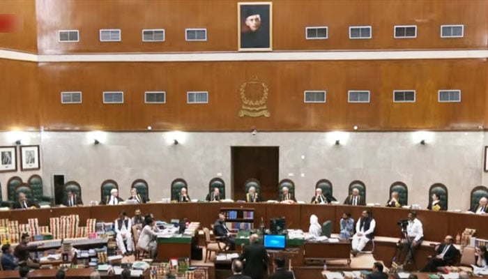 CJP Qazi Faez Isa (centre) heads a full court bench hearing petitions challenging the law seeking to curtail CJPs discretionary powers at the Supreme Court in Islamabad, on October 3, in this still taken from a video. — YouTube/State Media