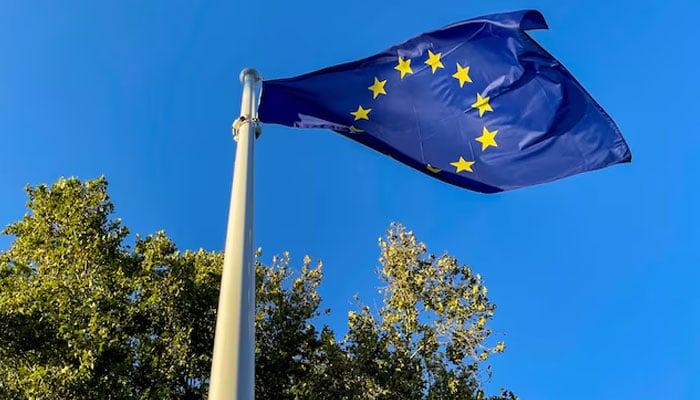 A European Union flag flutters outside the congress palace ahead of the European Political Community summit in Granada, Spain, October 4, 2023. — REUTERS