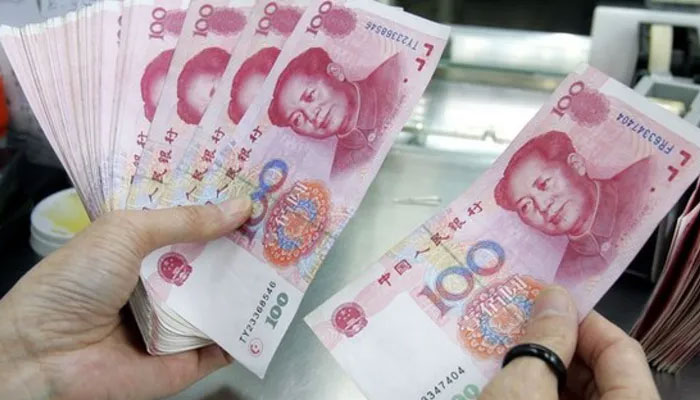 A representational image of a person counting Chinese currency Yuan notes. — AFP/File