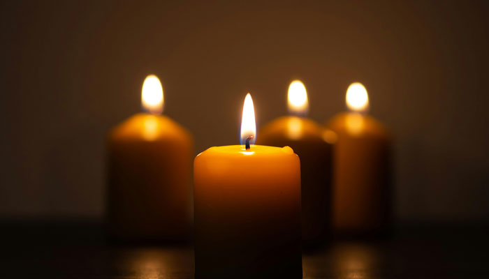 A representational image of candles at a death anniversary. — Pexels/File