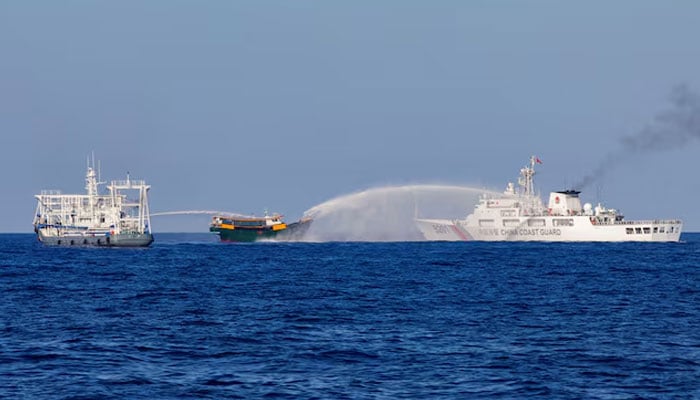 Chinese Coast Guard vessels fire water cannons towards a Philippine resupply vessel Unaizah May 4 on its way to a resupply mission at Second Thomas Shoal in the South China Sea, March 5, 2024.  — Reuters