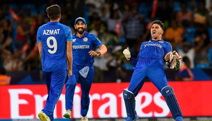 Afghanistans Rahmanullah Gurbaz (R) celebrate his teams win of the ICC mens Twenty20 World Cup 2024 Super Eight cricket match between Afghanistan and Australia at Arnos Vale Stadium in Arnos Vale, Saint Vincent and the Grenadines on June 22, 2024. — AFP