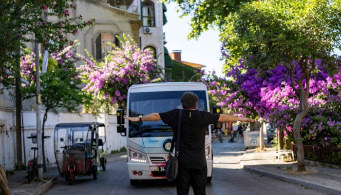 Lawyer and head of the Association of Friends of the Island Ibrahim Aycan, 47, is protesting to stop new minibuses on the island of Buyukada, in Istanbul on June 20, 2024. — AFP