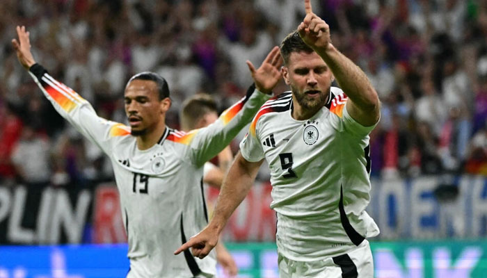 Germanys Niclas Fuellkrug (right) celebrates his equaliser against Switzerland on June 24, 2024. — AFP