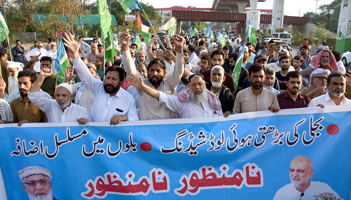 Activists of Jamaat-e-Islami shouting slogans during protest against inflated electricity bills, at Murree road in Rawalpindi on June 23, 2024. — Online