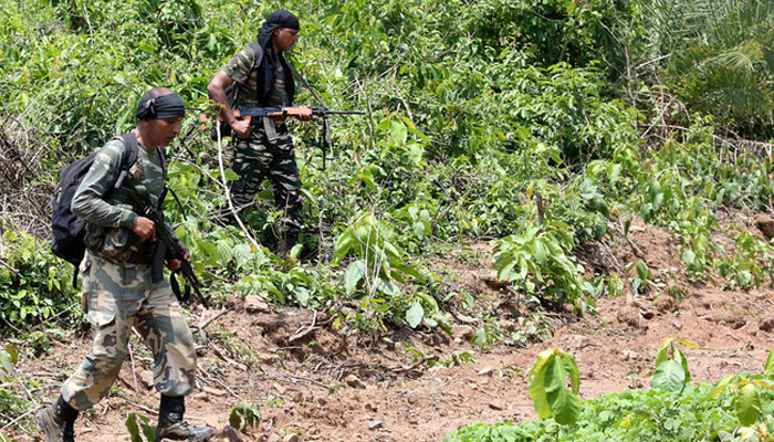 Two Indian Maoists seen walking in this undated image. — AFP/file