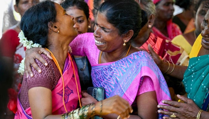 Relatives mourn those who died after drinking toxic alcohol in Indias Tamil Nadu state on Monday. — AFP/file