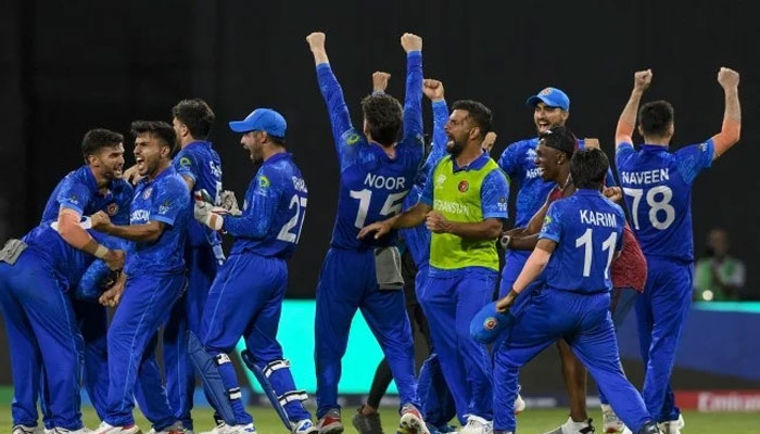Afghanistans players celebrate winning their ICC mens Twenty20 World Cup 2024 Super Eight cricket match against Bangladesh at Arnos Vale Stadium, Saint Vincent and the Grenadines on Tuesday. — AFP