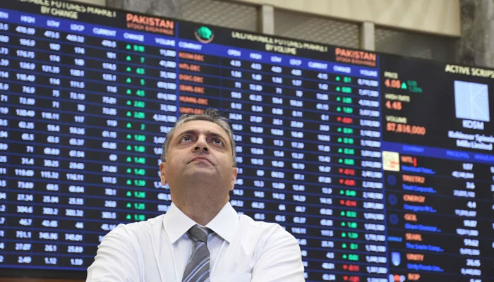 Pakistani stockbroker monitors the share prices during a trading session at the Pakistan Stock Exchange (PSX) on November 7, 2023. — Online