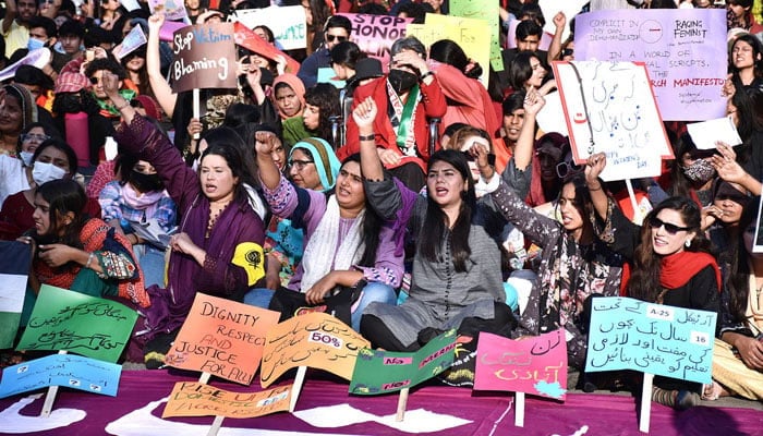 Participants displaying placards in a rally (Aurat March) to mark International Womens Day. — APP/file