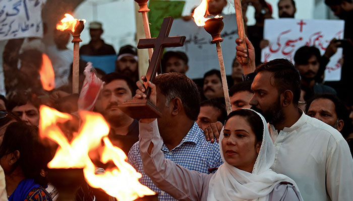 Christians hold a torchlight rally in Karachi on August 19, 2023, to condemn the attacks on churches in Pakistan. — AFP/File