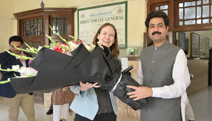 Minister for Social Welfare and Bait-ul-Maal Sohail Shaukat Butt presents flower bouquets to US Consul General Lahore Kristin K. Hawkins in Lahore on June 27, 2024. — Facebook/Social Welfare and Bait-ul-Maal Department, Government of the Punjab