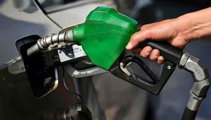 A person seen filling petrol in a car in this image. — AFP/File