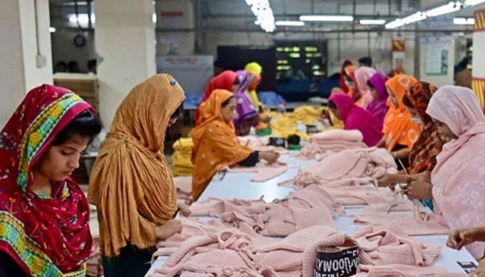A representational image showing women employees working at a garment factory on April 13, 2023. — AFP
