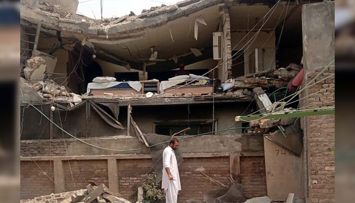 View of damages after guest house collapsed due to gas cylinder blast, at University Town in Peshawar on June 29, 2024. — PPI