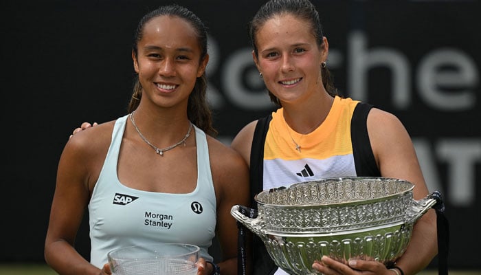 Russia´s Daria Kasatkina (R) holds the winners trophy as she poses with runner up Canada´s Leylah Fernandez, after their women´s singles final tennis match at the Rothesay Eastbourne International tennis tournament in Eastbourne, southern England, on June 29, 2024. — AFP