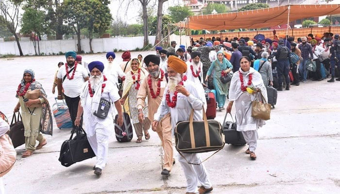 Sikh Yatrees at Wagah Border in Pakistan. — APP/File