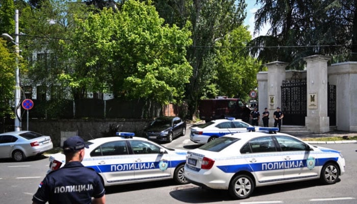 Police vehicles seen in front of the Israeli embassy in Belgrade. — AFP/file