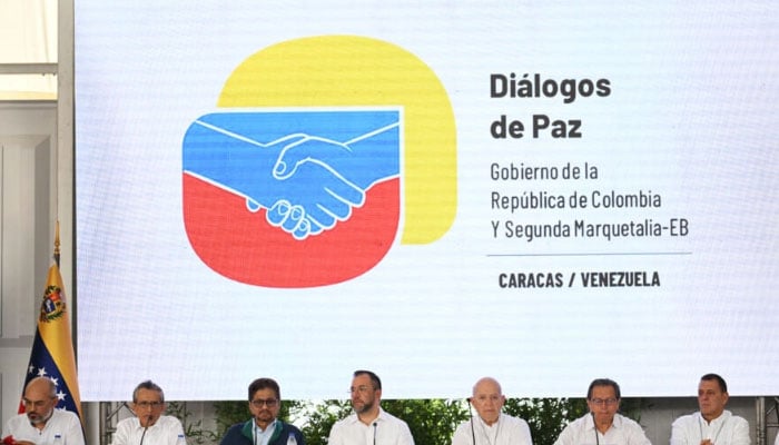 Delegations of Colombian government and Segunda Marquetalia FARC dissident group are pictured in the main table during the inauguration of peace talks in Caracas June 23, 2024. — AFP