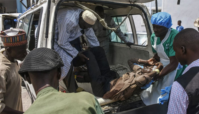 A man injured in one of the attacks arrives for treatment at a hospital in Maiduguri on Saturday. — AFP/file