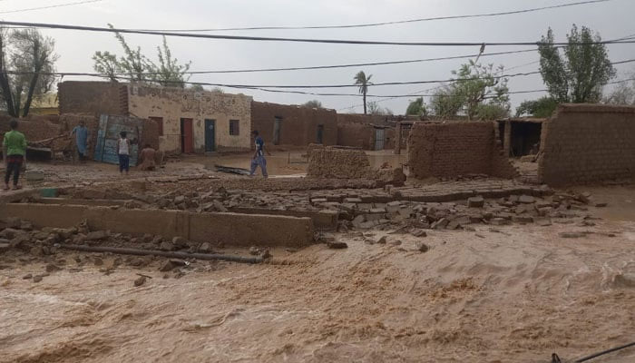 A collapsed wall of a building due to heavy rains can be seen in this image. — Reporter/Nadeem Kausar